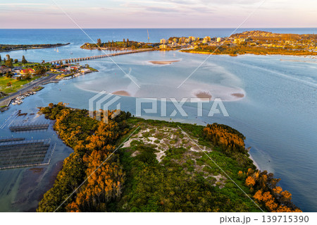 Aerial view of Wallis Lake in Forster NSW Australia. Drone photograph captures the expansive lake system, clear waterways and surrounding coastal landscape 139715390