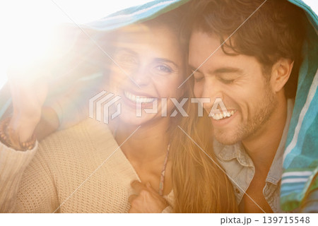 Couple, towel cover head and outdoor with smile, care and embrace for holiday in summer sunshine. Man, woman and portrait with bonding, happy and relax with love with tourism, vacation and break 139715548