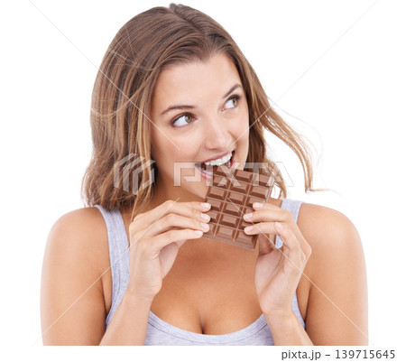 Woman, eating chocolate and love candy with mouth , pleasure and craving sugar in white background. Hungry, snack and meal for comfort, dessert and sweets for calories, diet and satisfaction Woman, eating chocolate and love candy with mouth , pleasure and craving sugar in white background. Hungry, snack and meal for comfort, dessert and sweets for calories, diet and satisfaction 139715645