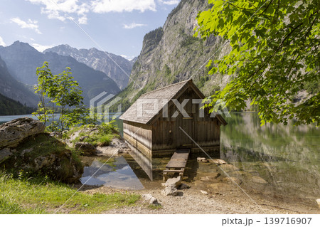 Small boathouse at lake Obersee, lake Konigssee, in the Berchtesgaden Alps, Bavaria, Germany 139716907