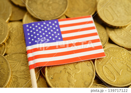 USA American flag on coin and banknote money, finance trading investment business currency concept. USA American flag on coin and banknote money, finance trading investment business currency concept. 139717122