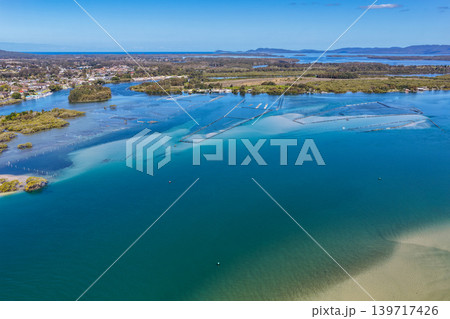 Aerial view of Wallis Lake in Forster NSW Australia. Drone photograph captures the expansive lake system, clear waterways and surrounding coastal landscape 139717426