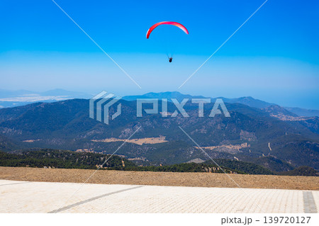 Flying paraglider at Babadag mountain in Turkey Flying paraglider at Babadag mountain in Turkey 139720127