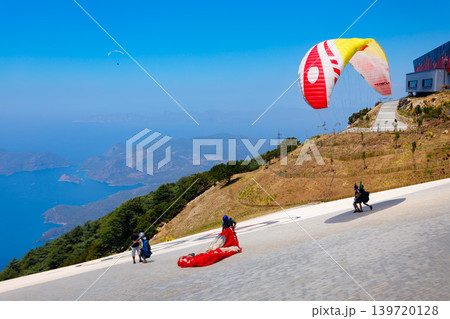 Flying paraglider at Babadag mountain in Turkey Flying paraglider at Babadag mountain in Turkey 139720128