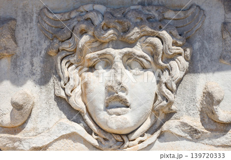 A stone carved Medusa head at the Temple of Apollo at Didyma in Didim 139720333