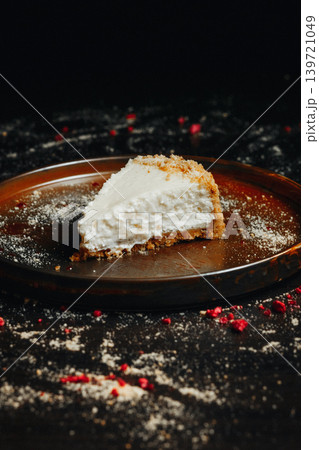 Single serving of rich, creamy cheesecake with red berry garnish Single serving of rich, creamy cheesecake with red berry garnish 139721049