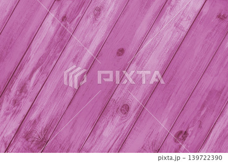 Pink colored painted wooden board with diagonal planks texture, rustic wall surface, background 139722390
