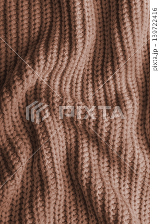 Brown knitted fabric texture with folds, wrinkles and soft waves, crumpled wool background Brown knitted fabric texture with folds, wrinkles and soft waves, crumpled wool background 139722416