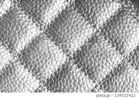 Macro of white quilted leather texture background with stitched pattern and shining metal effect Macro of white quilted leather texture background with stitched pattern and shining metal effect 139722422