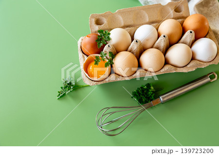 Healthy organic eggs with yolk and kitchen utensil flat lay Healthy organic eggs with yolk and kitchen utensil flat lay 139723200