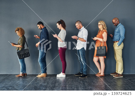 Businesspeople, job interview and waiting in line with technology or recruitment, onboarding or internet. Men, women and meeting diversity in queue or cellphone in office, human resources or hiring Businesspeople, job interview and waiting in line with technology or recruitment, onboarding or internet. Men, women and meeting diversity in queue or cellphone in office, human resources or hiring 139724625