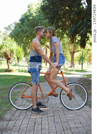 Romance, love and couple on bicycle journey, outdoor wellness and romantic date in nature. Travel, care and people cycling for bonding activity, transportation and connect with partner on bike ride Romance, love and couple on bicycle journey, outdoor wellness and romantic date in nature. Travel, care and people cycling for bonding activity, transportation and connect with partner on bike ride 139724694