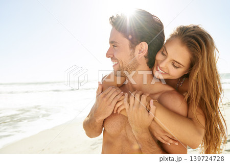 Happy couple, hug and sunshine on beach for love, care or support on holiday or outdoor weekend together. Face of man and woman smile for embrace, trust or summer travel in romance by the ocean coast 139724728