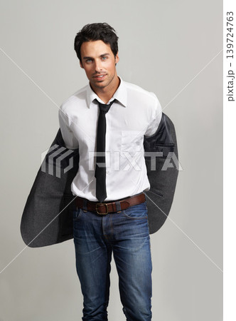 Fashion, confident and portrait of man in a studio with formal, elegant and classy outfit with blazer. Cool, handsome and young model from Canada with attractive style isolated by gray background. Fashion, confident and portrait of man in a studio with formal, elegant and classy outfit with blazer. Cool, handsome and young model from Canada with attractive style isolated by gray background. 139724763