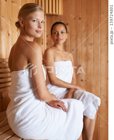 Sauna, spa and portrait of women to relax for beauty, detox or sweat for skincare wellness. Luxury, treatment and friends sitting together in steam room for facial, anti aging and benefits to body 139724801