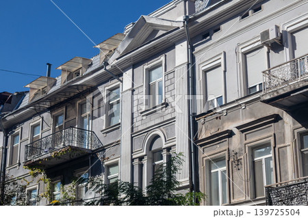 European Row House Facade with Balconies on Sunny 139725504