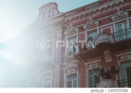 Vintage Red Building with Ornate Balconies 139725506