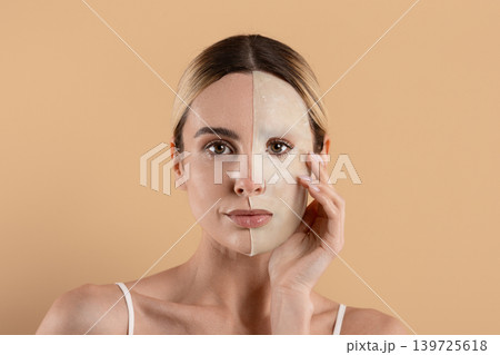 Young woman with half peel off facial mask showing skincare treatment Young woman with half peel off facial mask showing skincare treatment 139725618
