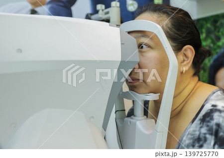Phoropter for eye test, lenses glasses for eye check in optical store.  139725770