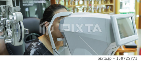 Phoropter for eye test, lenses glasses for eye check in optical store.  139725773