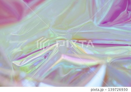 Iridescent plastic wrap abstract background with vibrant colors and soft glowing light Iridescent plastic wrap abstract background with vibrant colors and soft glowing light 139726930