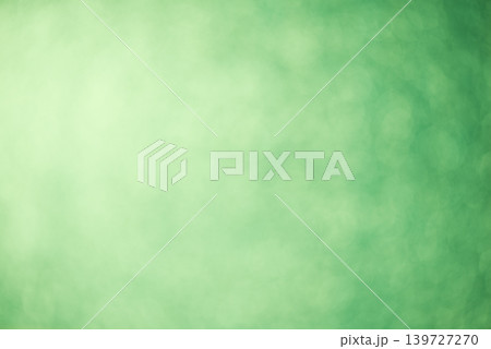 Green blurred background glitter background. Defocused sparkles Green blurred background glitter background. Defocused sparkles 139727270