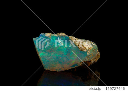 macro mineral stone rare and beautiful opals on a black background 139727646