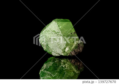 macro mineral stone Demantoid on a black background 139727670