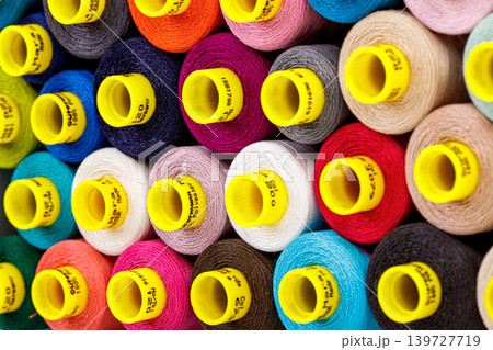 set of multi-colored spools of thread for sewing 139727719