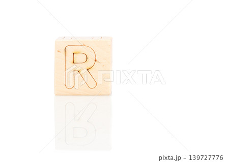 Wooden cubes with letters R on a white background Wooden cubes with letters R on a white background 139727776