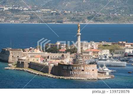 Madonna della Lettera statue over Messina harbor and historic fortress. Messina, Sicily, Italy Madonna della Lettera statue over Messina harbor and historic fortress. Messina, Sicily, Italy 139728076