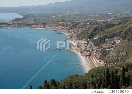Panoramic view of Giardini-Naxos coastline in Sicily from Taormina Panoramic view of Giardini-Naxos coastline in Sicily from Taormina 139728079