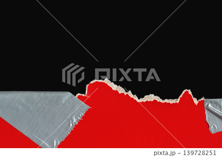 Torn red paper with duct tape repair on black background, showing ripped edge, fiber texture, and copy space. Natural backdrop of paper damage, repair, tear, warning, barrier, craft design 139728251