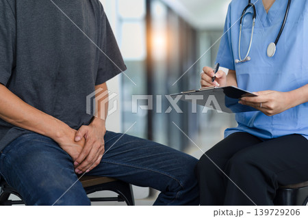 Male doctor and testicular cancer patient discuss the test results. Testicular cancer and prostate cancer concept Male doctor and testicular cancer patient discuss the test results. Testicular cancer and prostate cancer concept 139729206