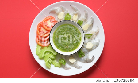 shrimp in fish sauce with Thai spicy seafood dipping sauce on white plate 139729594