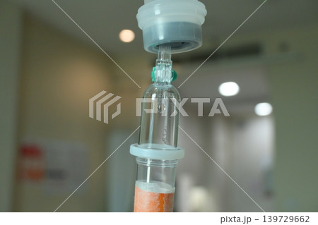saline solution drip for patient and infusion pump in hospital, close up equipment of medicine saline solution drip for patient and infusion pump in hospital, close up equipment of medicine 139729662