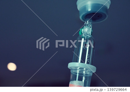 saline solution drip for patient and infusion pump in hospital, close up equipment of medicine 139729664
