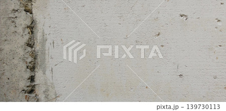 Close-up image of a white plaster wall with a rough texture and surface details like natural semen. Close-up image of a white plaster wall with a rough texture and surface details like natural semen. 139730113