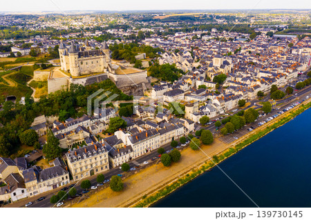 View of Saumur with medieval fortified Chateau and parish church 139730145