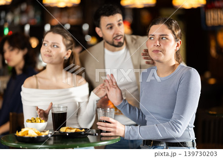 Young man flirting with two women getting rejected 139730203