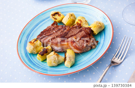 Grilled veal steak with artichokes, healthy dinner 139730384