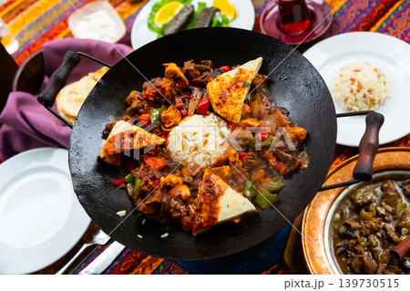 Koban kavurma is a Turkish dish made from fried meat, rice and vegetables. Koban kavurma is a Turkish dish made from fried meat, rice and vegetables. 139730515