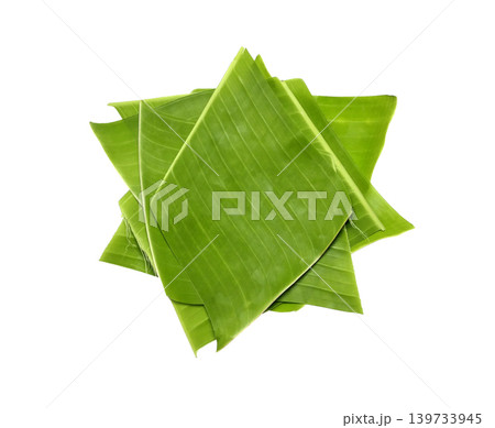 Pieces of green banana leaves are stacked on top of each other isolated on white background 139733945