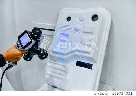 Engineer using portable 3D laser scanner for industrial quality control inspection Engineer using portable 3D laser scanner for industrial quality control inspection 139734031
