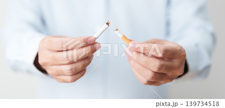 Man hand break cigarette for World No Tobacco Day concept, quitting smoking to prevent Lung Cancer, COPD, Emphysema and Tuberculosis disease. healthy lifestyle resolution, stop nicotine addiction Man hand break cigarette for World No Tobacco Day concept, quitting smoking to prevent Lung Cancer, COPD, Emphysema and Tuberculosis disease. healthy lifestyle resolution, stop nicotine addiction 139734518