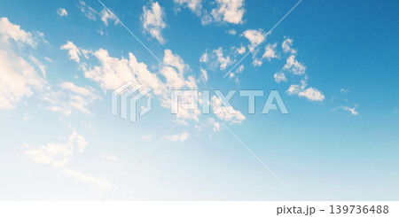 Soft clouds drift across a bright blue sky Soft clouds drift across a bright blue sky 139736488