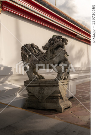 Historic Chinese stone lion statue, used as ship ballast in Rama III era, at Wat Pho temple. Historic Chinese stone lion statue, used as ship ballast in Rama III era, at Wat Pho temple. 139736569