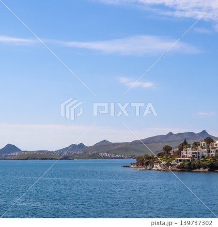 Bitez bay in Bodrum, Turkey with coastal homes on a green hillside overlooking the Aegean Sea Bitez bay in Bodrum, Turkey with coastal homes on a green hillside overlooking the Aegean Sea 139737302