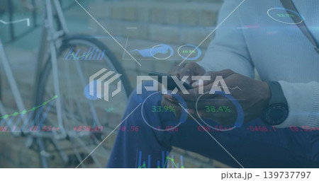Tapping mature man wearing light sweater at brick wall with phone, bike wheel, watch, data UI Tapping mature man wearing light sweater at brick wall with phone, bike wheel, watch, data UI 139737797