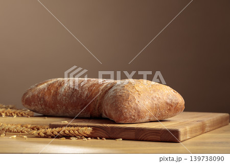 Fresh backed ciabatta bread on a wooden table. 139738090